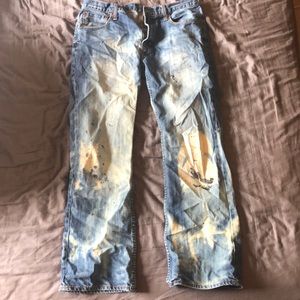 Disstressed bleached paint splattered jeans